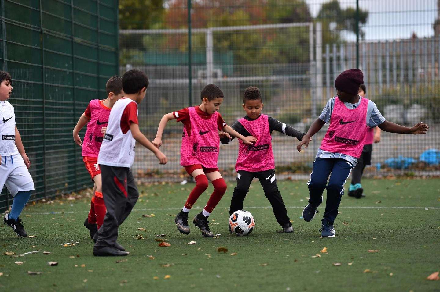 Participants playing football at an LFC Foundation Kicks Session