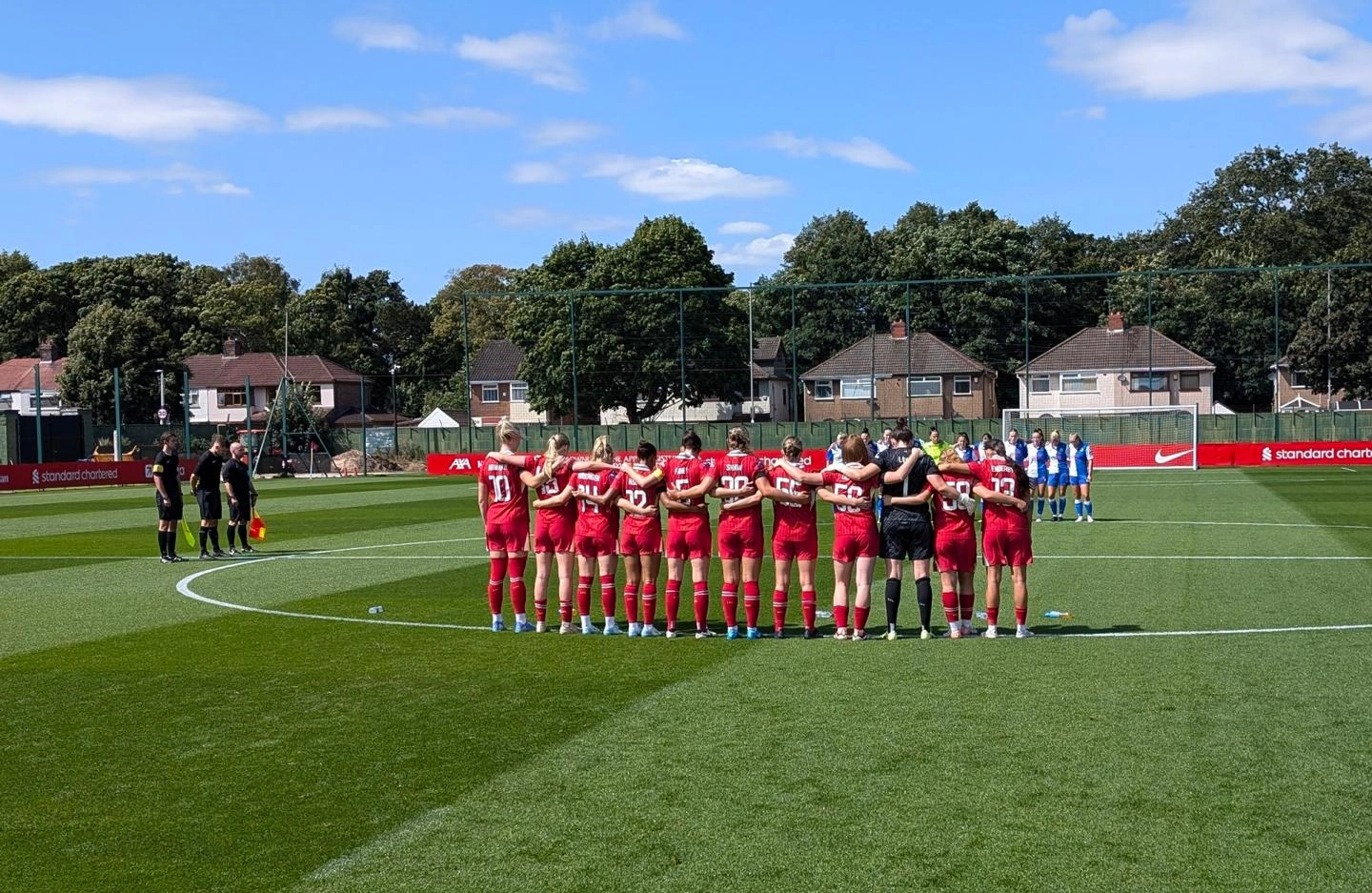 Players and officials observe a minute's silence before kick-off