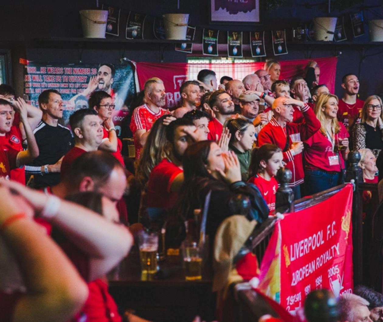 LFC fans in an OLSC cheering on the reds