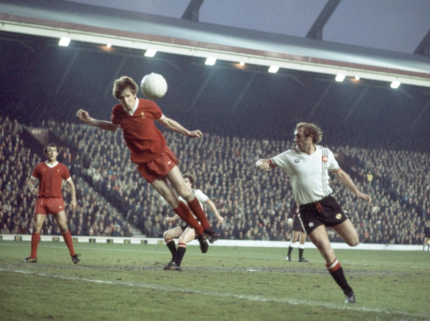 1975: Jones in action at Anfield against Manchester United.