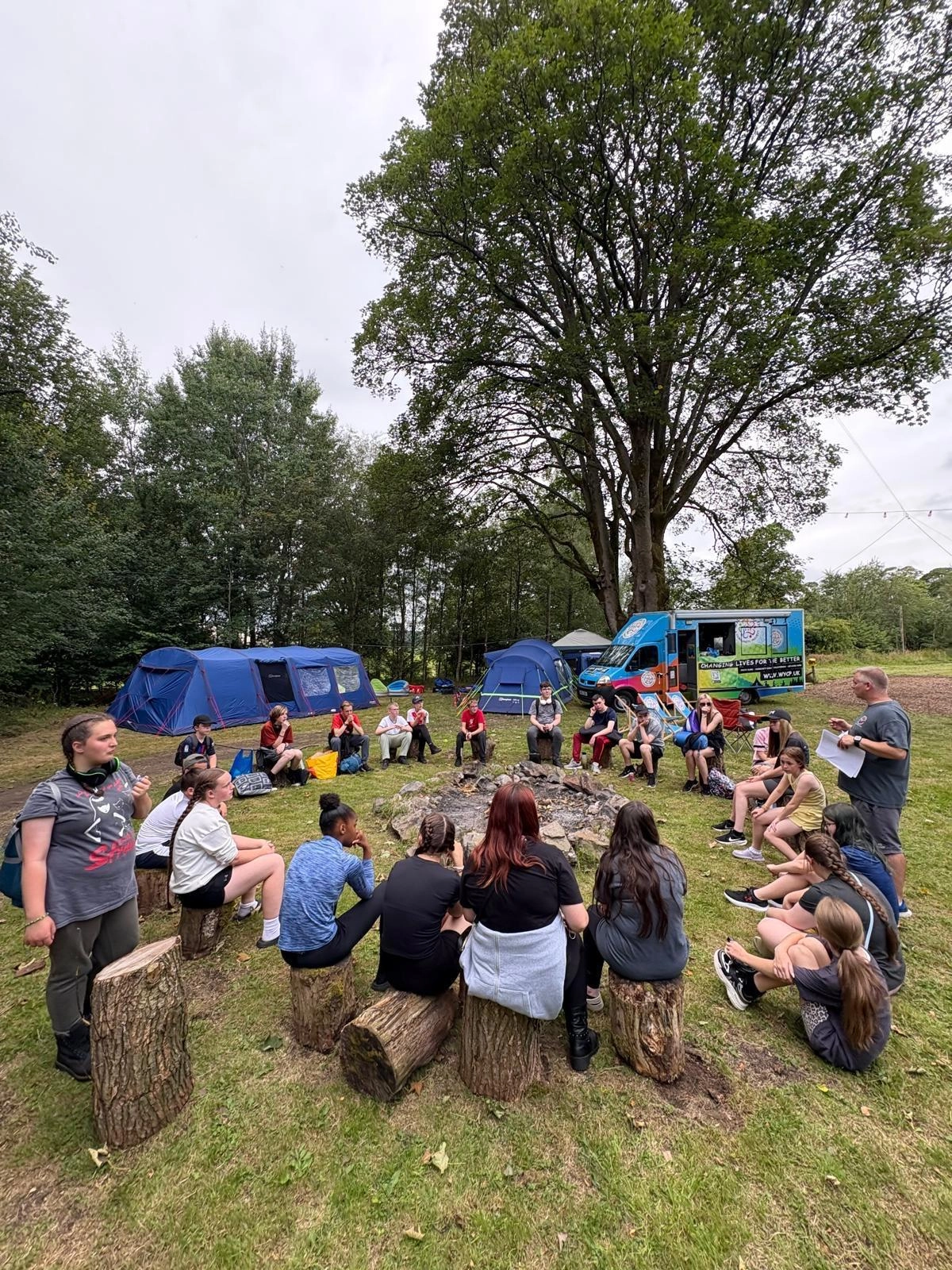 Youth Apprentices at a campfire