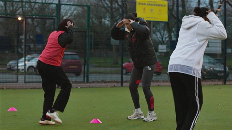 Nasrin and Faye Kirby doing football drills