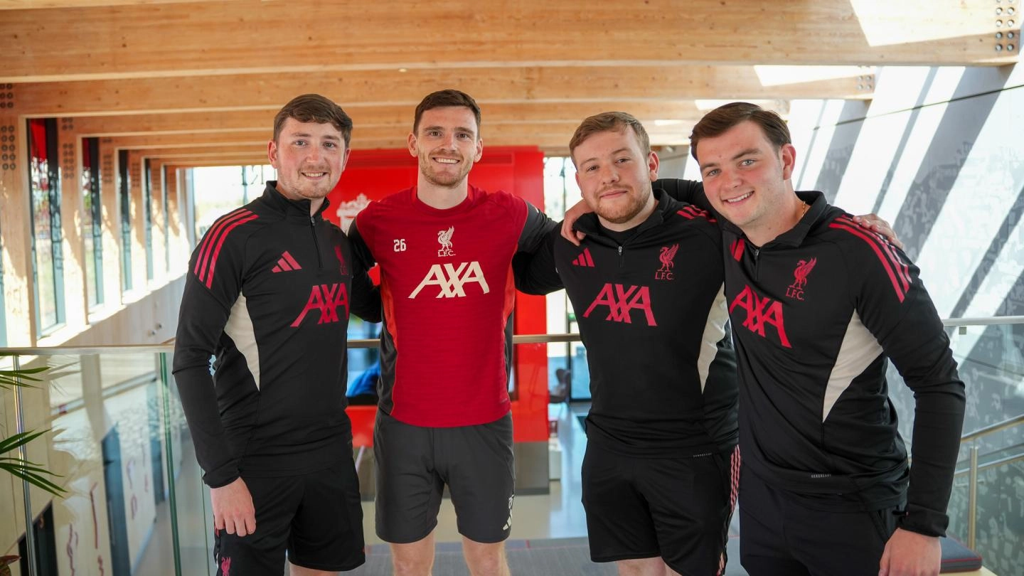 Andy Robertson and 3 LFC Foundation apprentices smiling for a photo at AXA Training Centre