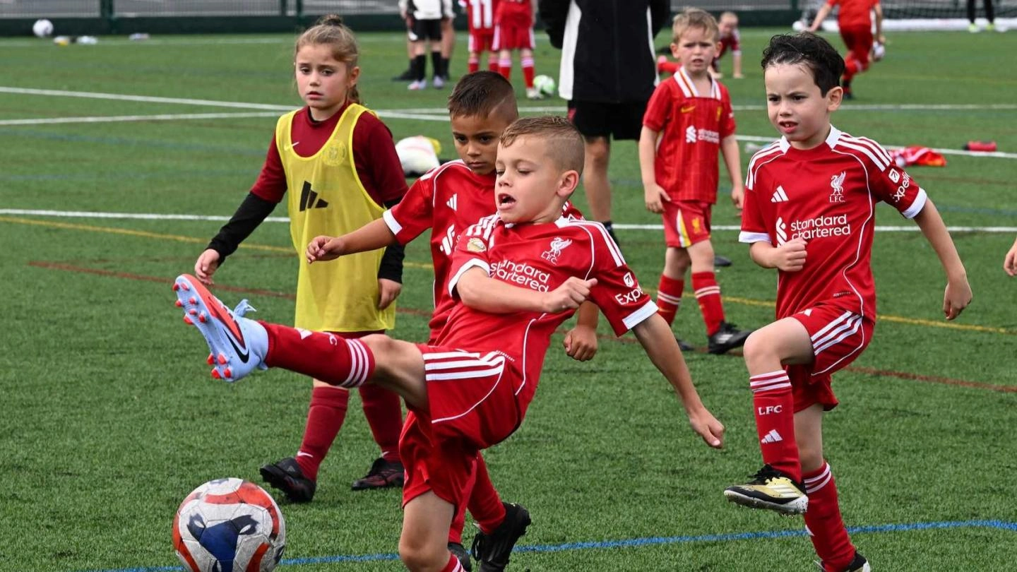 A young child taking part in an LFC Foundation football camp.