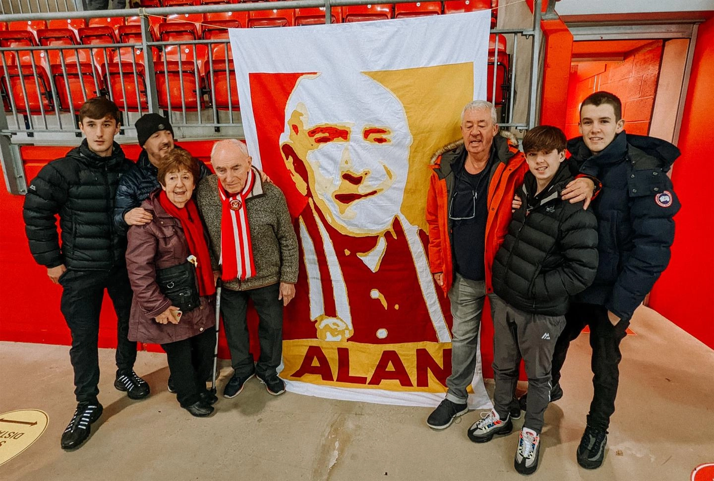 The Edwards family with Alan's banner