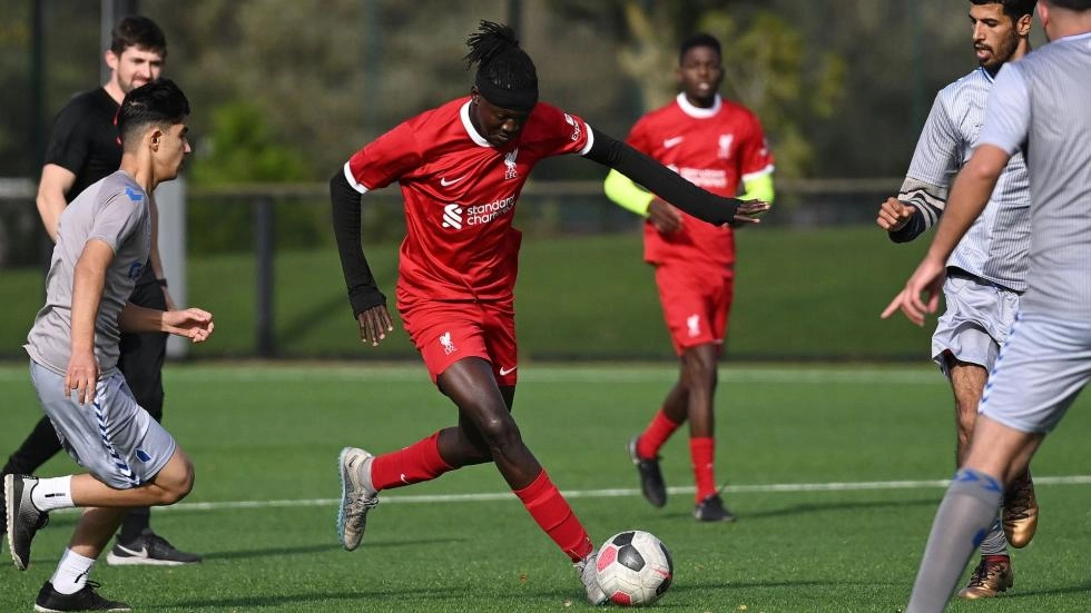 red together refugee and asylum seeker football image