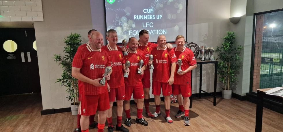 Military Veterans posing at football tournament 